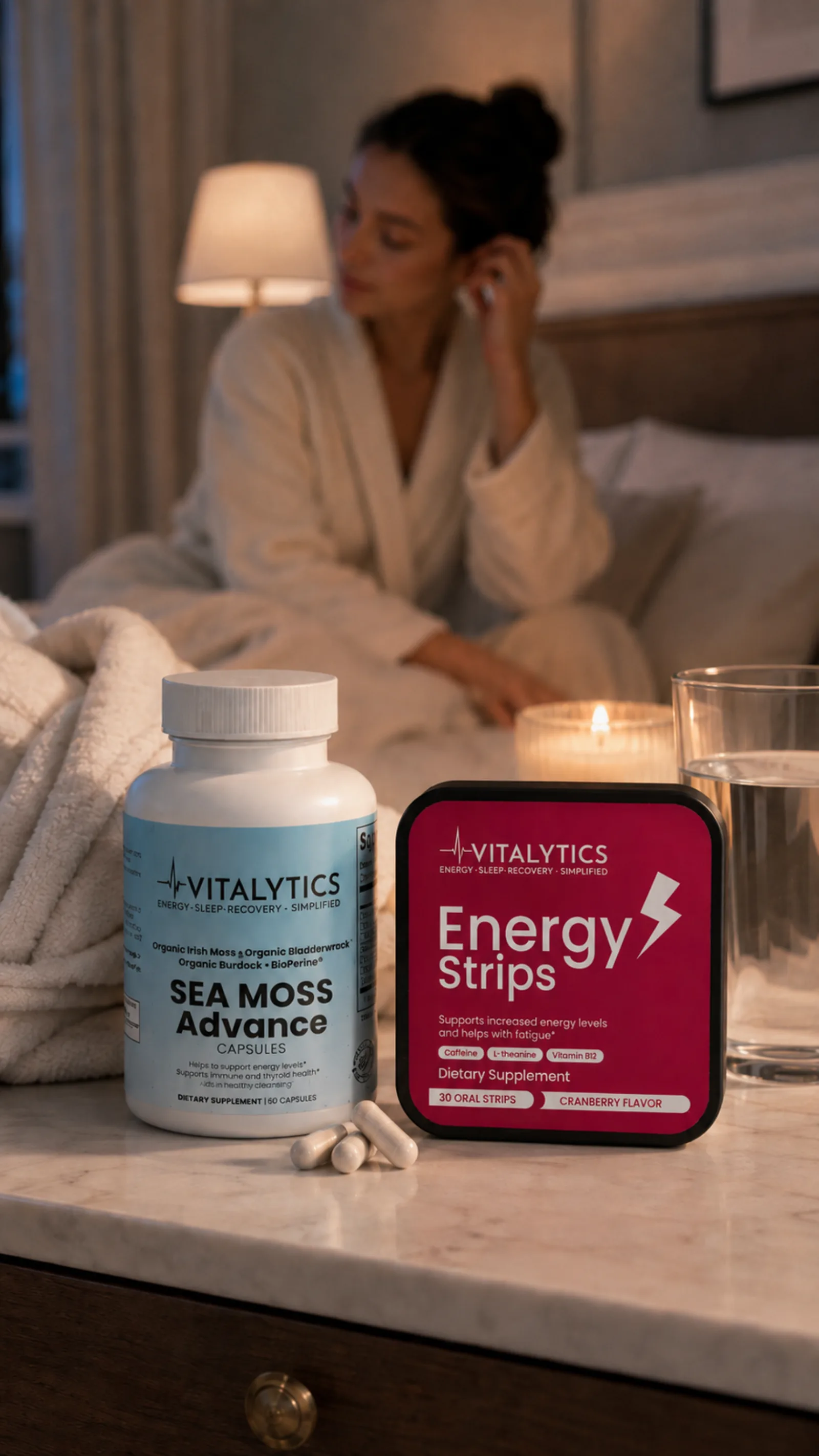 Evening bedside setup with Vitalytics Sea Moss Advance and Energy Strips near a candle and glass of water.